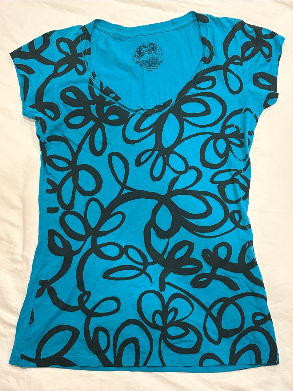 Stranded Bright Teal Short-Sleeve V-Neck Tee with Black Floral Swirl
